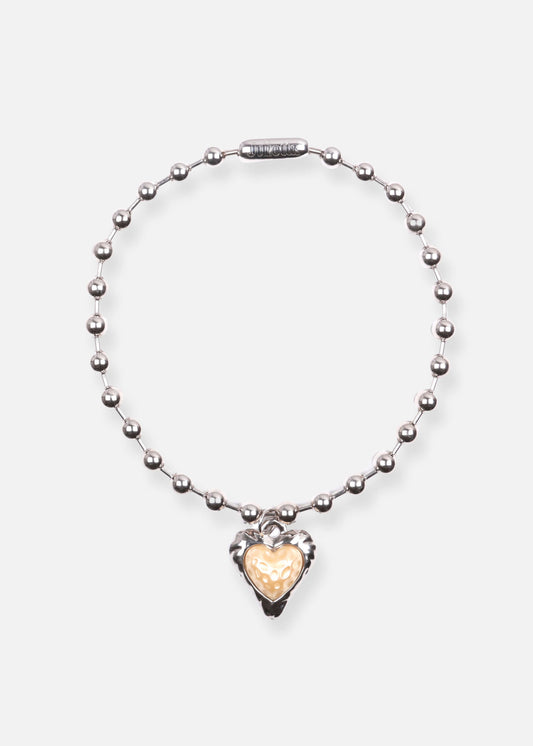 Discover Penny Lane necklace: ball chain, resin pearl heart, rhodium-plated brass. Handmade elegance!